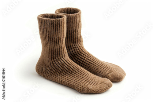 A pair of camel wool socks on white background