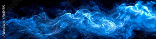 Blue swirling flowing smoke on black background wide format illustration.  photo