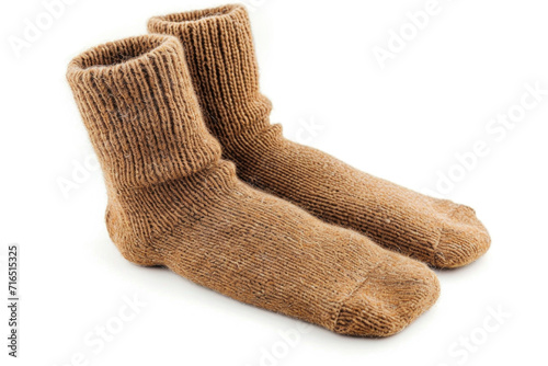 A pair of camel wool socks on white background