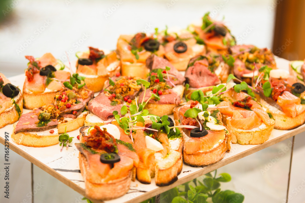 Sandwiches with meat, fish and microgreens. Sandwiches with meat, fish and microgreens.