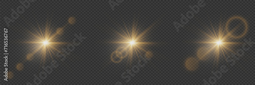 Set of shining stars and glares of light, sun particles and sparkles with effect, golden lights and sparkles. On a transparent background. Vector, EPS10 photo