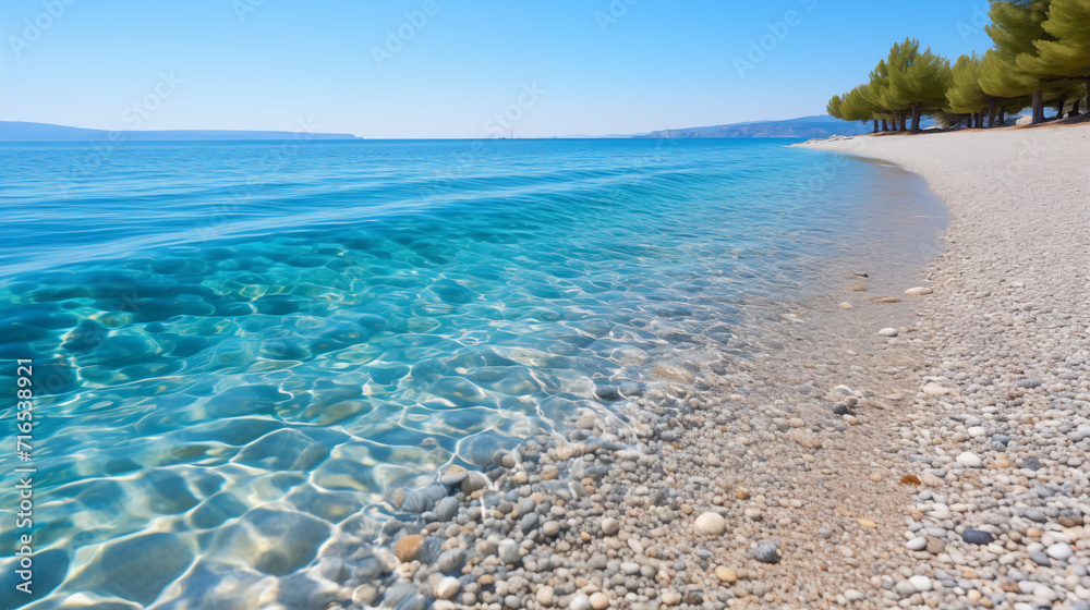 clear turquoise water and white pebbles on the beach