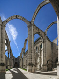 Ruins of the Gothic Church of the Carmo Convent aka Our Lady of Mount Carmel. Roofless nave and arches stand as a testimony to the 1755 earthquake that destroyed Lisbon. Lisbon, Portugal