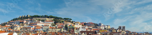 Skyline panorama of the oldest part of Lisbon with Sao Jorge Castle and Lisbon Cathedral and Alfama, Mouraria and Castelo districts. Lisbon cityscape photo