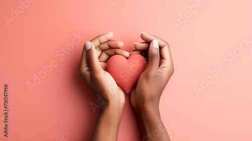Two pairs of intertwined hands forming a heart shape , Two pairs of intertwined hands, heart shape