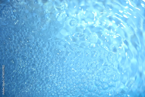 Blue water texture. Bubbles and bubbling water.