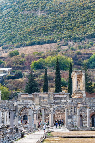 Beautiful view from main agora to the Gate of Augustus and the side of Library of Celsus in ancient Ephesus with the hillside at background. Selcuk, Izmir, Turkey