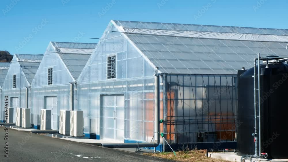 Modern High-tech Greenhouse on a sunny day. Modern High-tech Greenhouse on a sunny day.