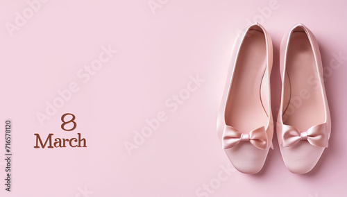 Ballet flats on a pink background with the inscription 8 March. The concept of International Women's Day