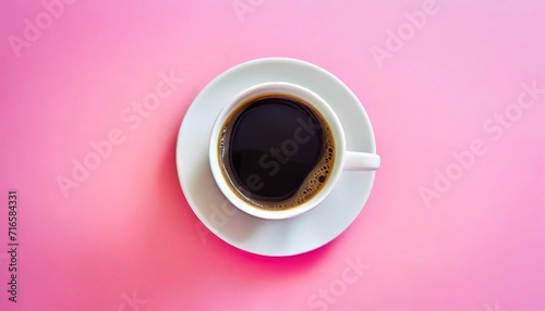 a cup of fresh coffee on pink background