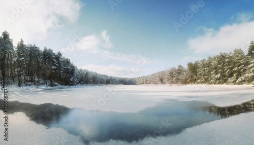 frozen lake and snow covered forest