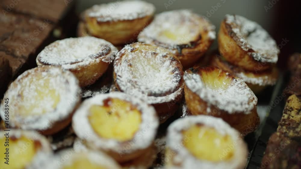 Close Up of a Stack of Powdered Portuguese Tarts Close Up of a Stack of Powdered Portuguese Tarts