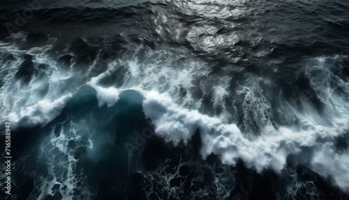 top view of sea waves black water background texture