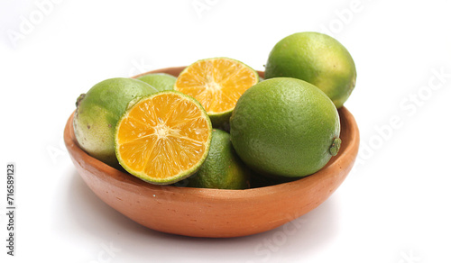 Yellow lemon in a clay bowl. Lemon from Brazil.