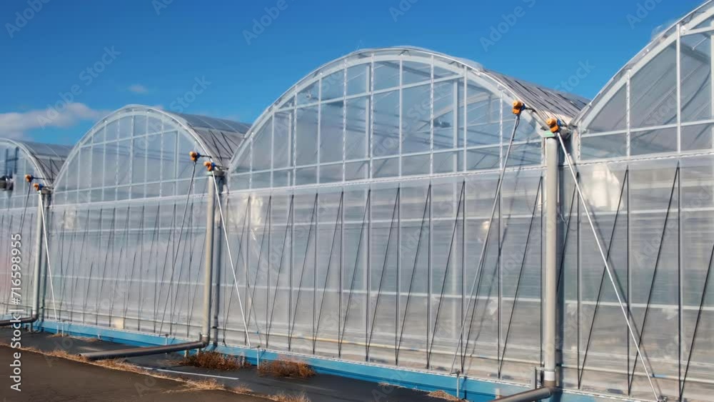 Modern High-tech Greenhouse on a sunny day. Modern High-tech Greenhouse on a sunny day.