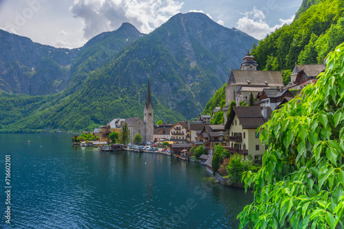 Hallstatt, a charming village on the Hallstattersee lake and a famous tourist attraction, with beautiful mountains surrounding it, in Salzkammergut region, Austria, in summer sunny day.