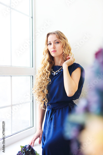 Beautiful blond girl with long curly hair