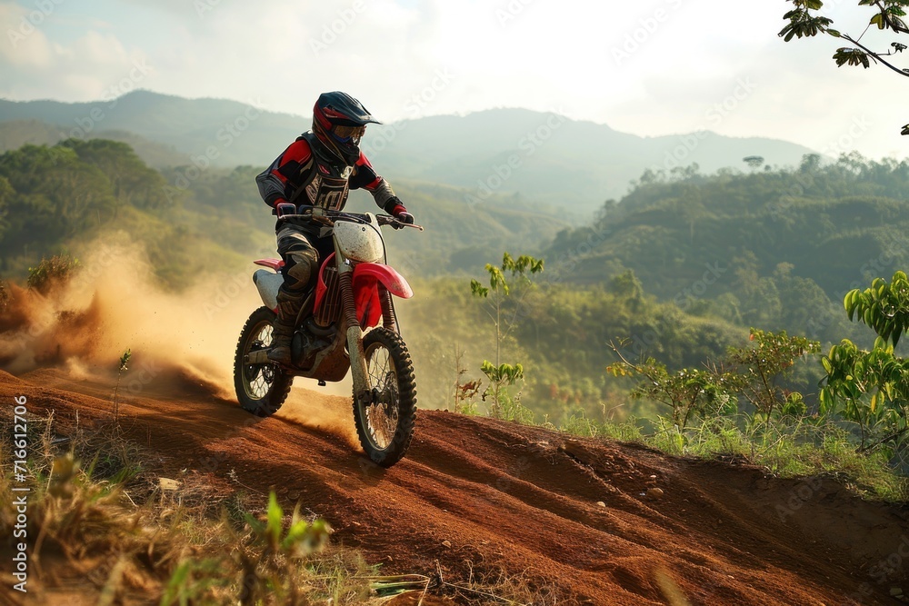 Motocross rider in action on a dirt road in the mountains. Motocross. Enduro. Extreme sport concept.