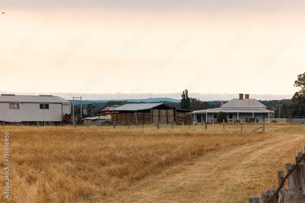 Rural farm with old style farm house, hay and shearing shed in Country Victoria Rural farm with old style farm house, hay and shearing shed in Country Victoria