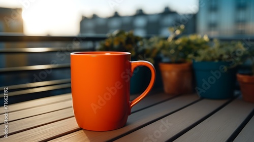 Balcony View of a orange Mug on a wooden Table. Close up with a blurred Background