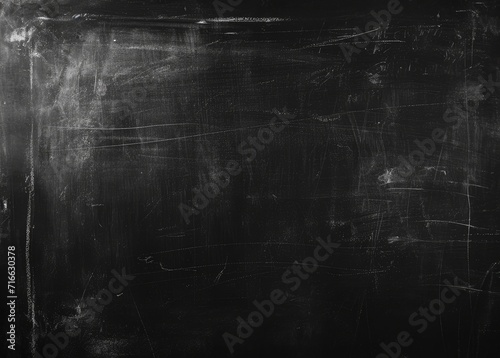 A detailed shot of a dark grey textured surface that emulates the look of a blackboard or slate with subtle variations in shading and light. Ai generated photo