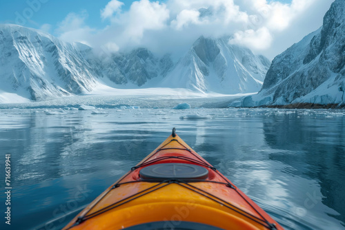 kayaking on a sea kayak against the backdrop of arctic shores © Evgeny