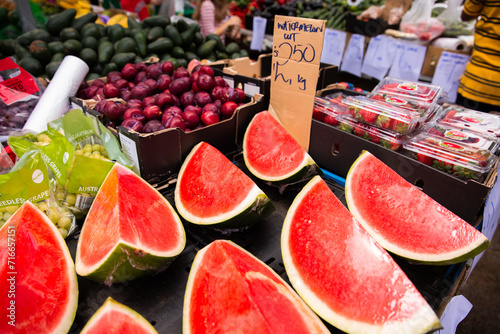 cut watermelon for sale at farmers markets photo