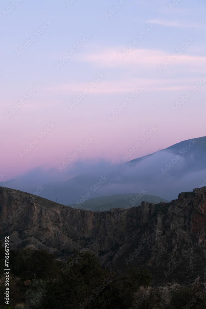 A stunning purple and blue sunset over the mountains 