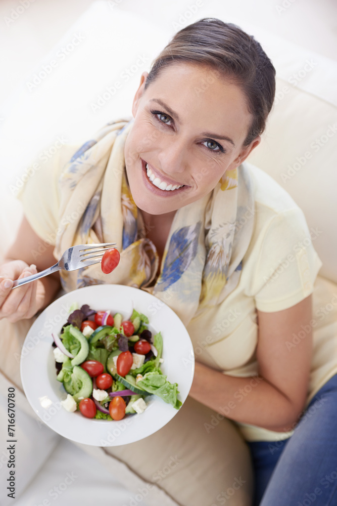 Top view of woman, eating salad and food for nutrition, vegetables and lunch with happiness in portrait. Diet, wellness and healthy vegan meal for cholesterol, detox and snack for dinner at home