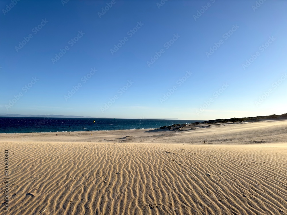 Fototapeta premium large sand dune of Valdevaqueros in Andalusia with a view to the Atlantic Ocean, Morocco at the horizon, Tarifa, Costa de la Luz, province of Cádiz, Spain, Travel, Tourism
