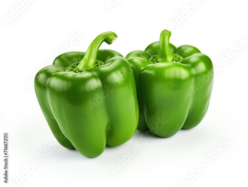 Vibrant green bell peppers, isolated on white, boast freshness and crispness. Versatile kitchen companions, elevate your dishes with their vibrant flavor