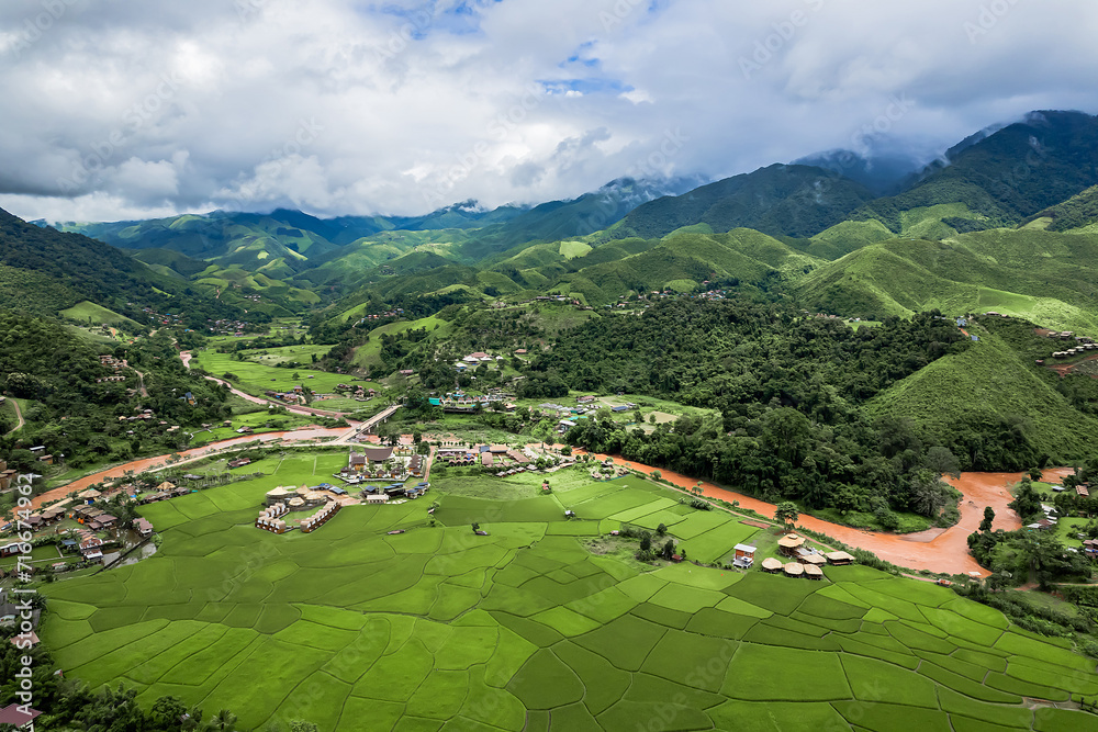 Beautiful Sapan village and stunning landscape of green rice field at Nan province, Thailand.