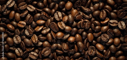  a pile of coffee beans sitting next to each other on top of a pile of brown and white coffee beans on top of a pile of brown and white coffee beans.