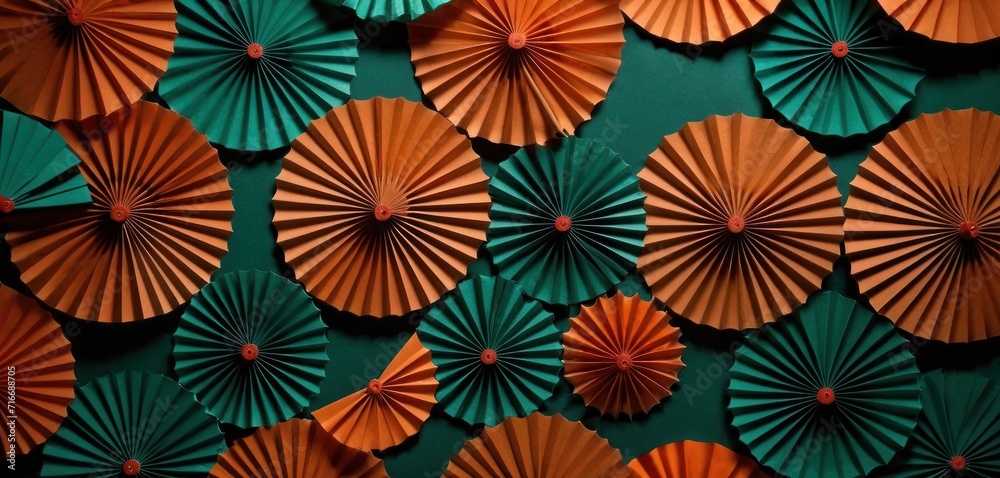 a group of orange and green paper umbrellas on a green and green wall with a green wall in the background and a green wall in the middle of the background. a group of orange and green paper umbrellas on a green and green wall with a green wall in the background and a green wall in the middle of the background.