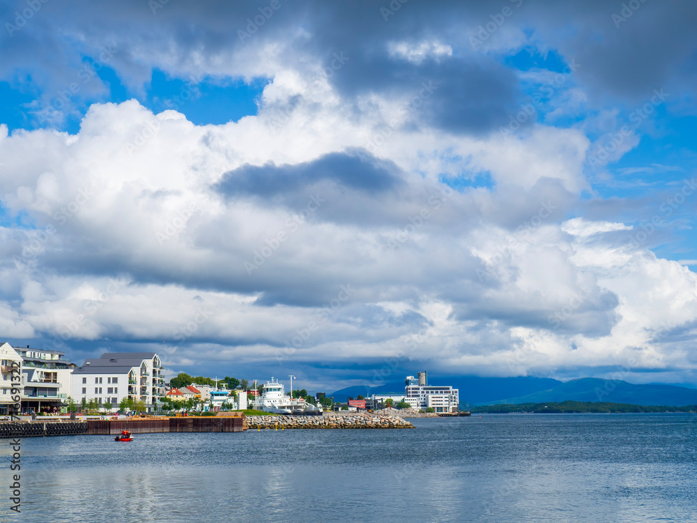 View across the bay at Molde water front with a car ferry in port.