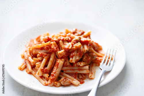 italian sausage cavatelli pasta in tomato sauce