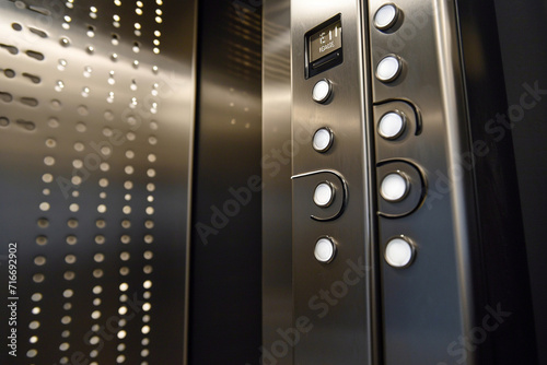 close-up of an elevator with accessible controls and braille signage, ensuring ease of use for individuals with diverse needs in a minimalistic photo