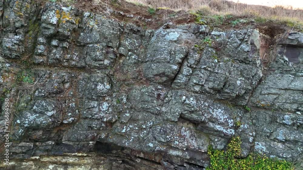 A drone flying over the rocky coastline 