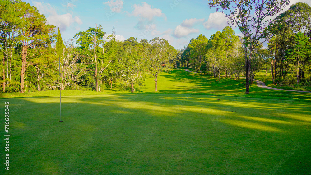 View of golf course with beautiful putting green.