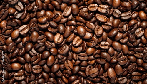  a pile of coffee beans sitting next to each other on top of a pile of brown and white coffee beans on top of a pile of brown and white coffee beans.
