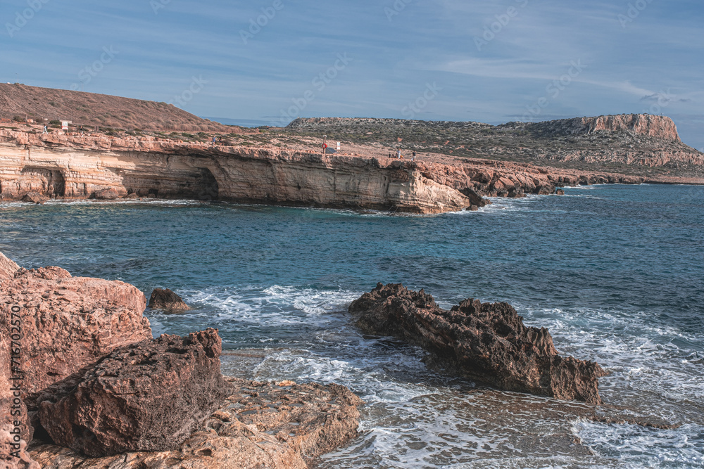 View towards Cape Greco (in the east) of the dramatic Sea Caves, stunning rock formations on the south-eastern coastline of Cyprus, between the town of Ayia Napa and Cape Greco