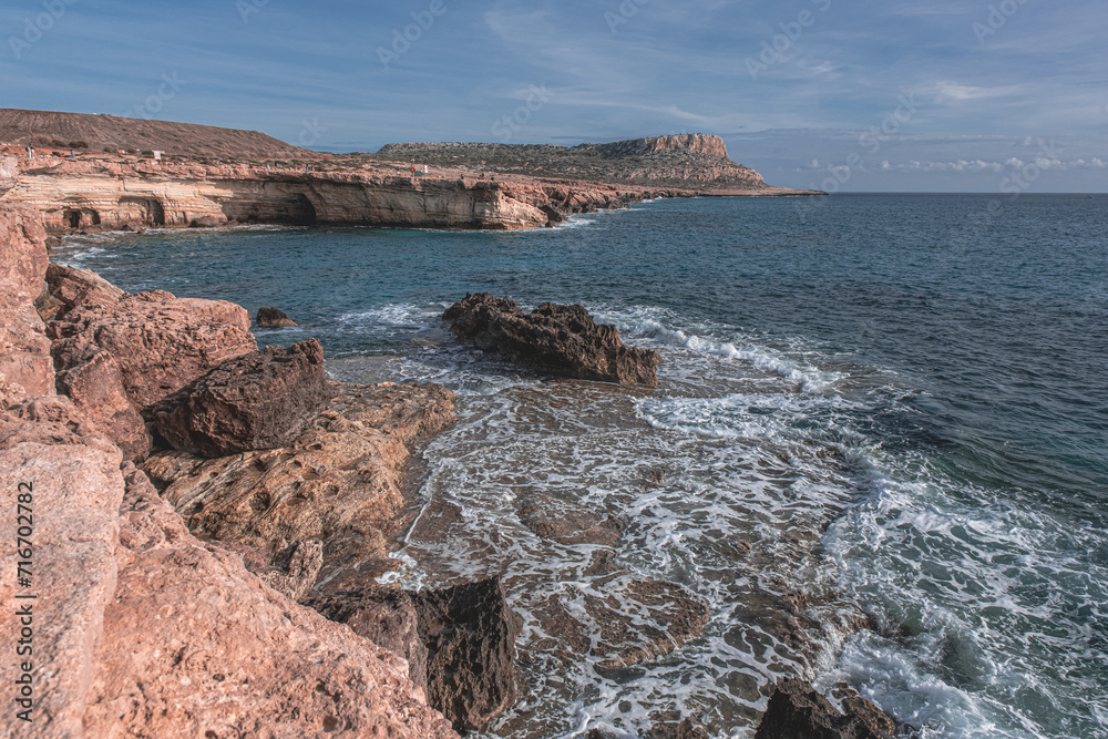 View towards Cape Greco (in the east) of the dramatic Sea Caves, stunning rock formations on the south-eastern coastline of Cyprus, between the town of Ayia Napa and Cape Greco