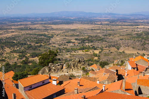 photo background panorama view of  red tiled roofs in Monsanto and the valley with mountains around it, Portugal, Europe