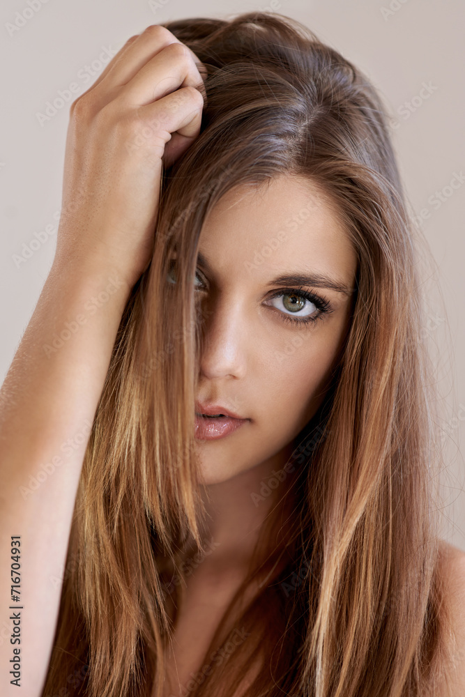 Portrait, straight hair and woman with makeup in salon treatment for care. Serious face, hairstyle shine and confident model in beauty cosmetics at hairdresser isolated on a brown studio background Portrait, straight hair and woman with makeup in salon treatment for care. Serious face, hairstyle shine and confident model in beauty cosmetics at hairdresser isolated on a brown studio background