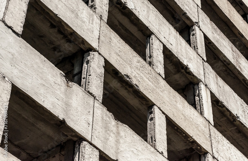 abstract background fragment of a concrete block building with empty windows