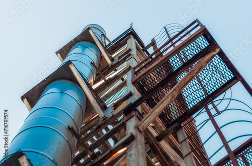 high technical structure with a pipe against the blue sky