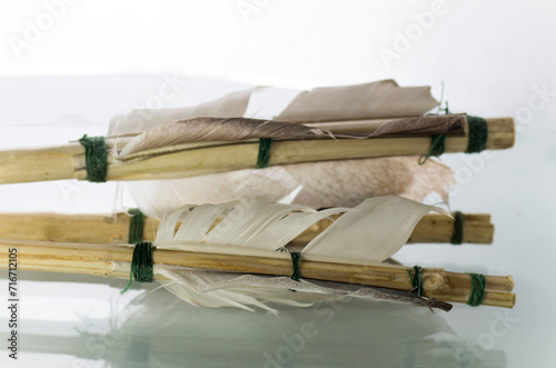 Fletching on homemade arrows on a white background