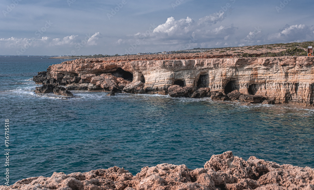 View towards the west of the dramatic Sea Caves, stunning rock formations on the south-eastern coastline of Cyprus, between the town of Ayia Napa and Cape Greco  