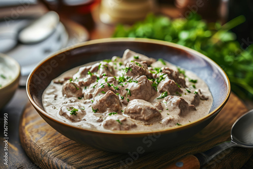 Creamy beef stroganoff with fresh greenery. Generative AI photo