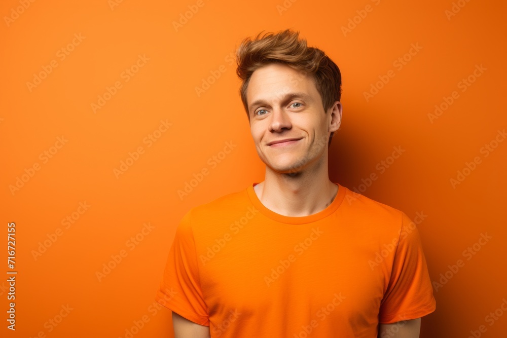Portrait of a satisfied man in his 20s sporting a vintage band t-shirt against a soft orange background. AI Generation Portrait of a satisfied man in his 20s sporting a vintage band t-shirt against a soft orange background. AI Generation